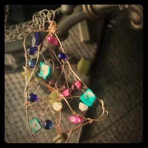 Handmade pendant from wire and beads